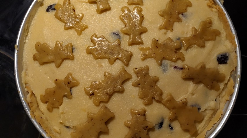The semolina custard tart with bear biscuits on the surface, before getting into the oven
