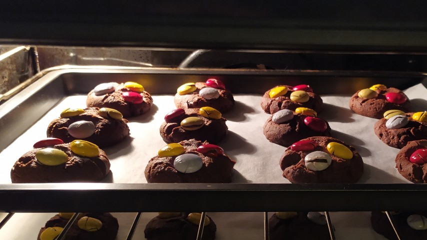 The candy cookies on a tray in the oven